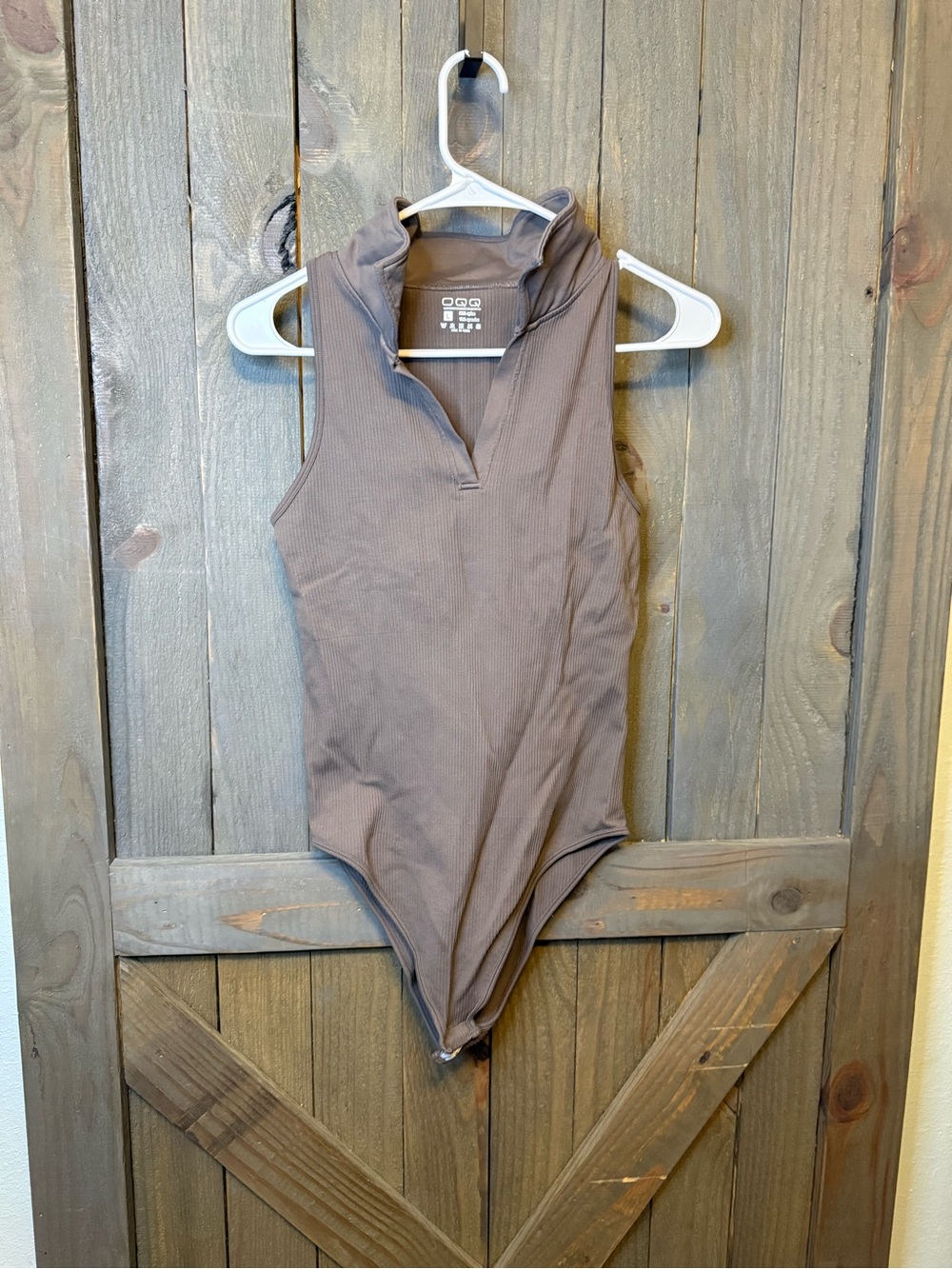 Sleeveless Mock-Neck Ribbed Bodysuit in Taupe